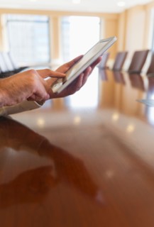Hands of businessman using tablet pc.