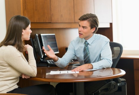 Businessman and client talking in office.