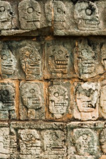 Mexico, Yucatan, Chichen Itza. Mayan carvings representing human skulls.