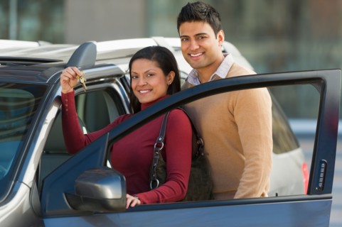 Couple with new car.