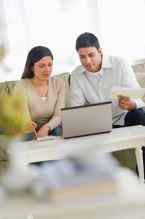 Couple using laptop.