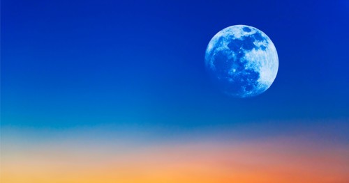 Full moon on evening sky.