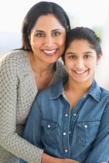 Portrait of mother and daughter (12-13).