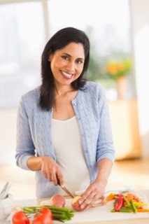 Woman cutting vegetables.