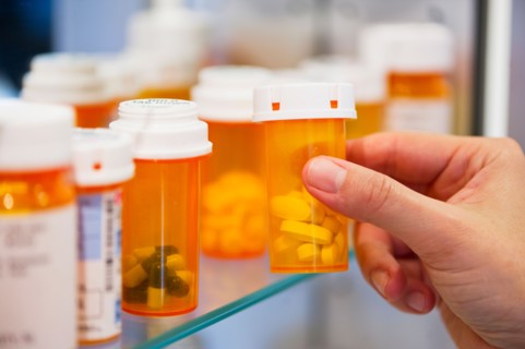 Pill bottles on shelf.