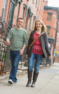 Couple walking on street.