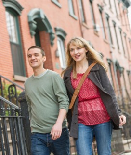 Couple walking on street.