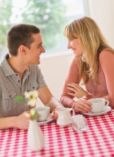 Couple sitting at table.