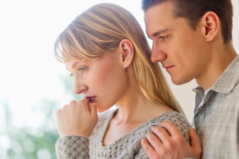 Portrait of sad couple.