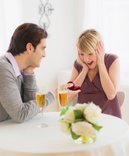 Couple celebrating engagement in restaurant. Photo : Daniel Grill