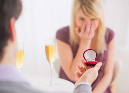 Couple celebrating engagement in restaurant. Photo : Daniel Grill
