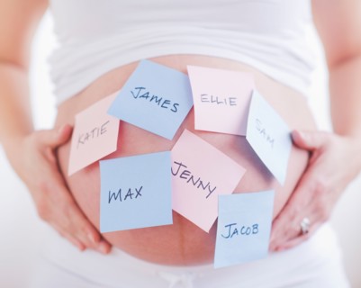 Pregnant woman with labels on her belly. Photo : Daniel Grill