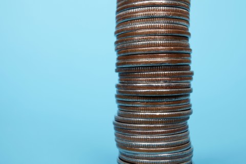 Studio shot of stack of coins. Photo : Winslow Productions