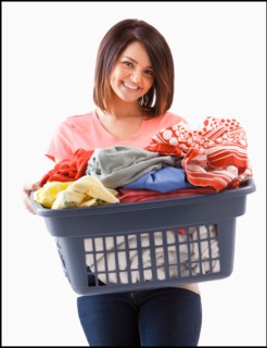 Young woman with laundry basket. Photo : Mike Kemp