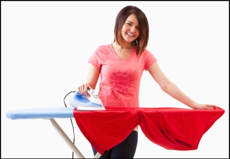 Young woman ironing. Photo : Mike Kemp