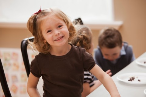 Portrait of girl (2-3) in kindergarten. Photo : Mike Kemp