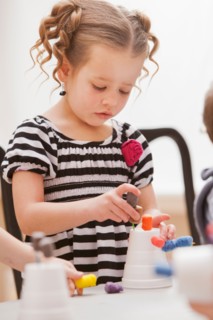 Girl (2-3) playing in kindergarten. Photo : Mike Kemp