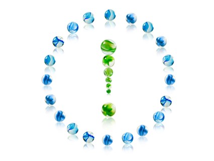 Studio shot of green marbles arranged in Exclamation Point. Photo : David Arky