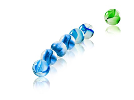 Studio shot of green marbles arranged in Exclamation Point. Photo : David Arky