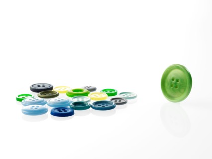 Studio shot of green marbles arranged in Exclamation Point. Photo : David Arky
