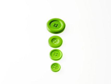 Studio shot of green buttons in a row. Photo : David Arky