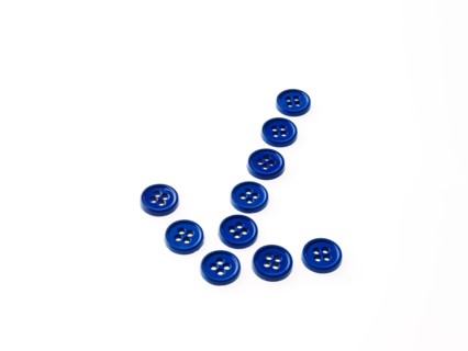 Studio shot of buttons arranged in arrow. Photo : David Arky