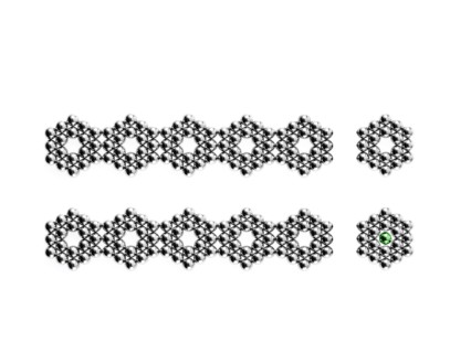 Studio shot of Pachinko balls arranged in two rows of hexagons. Photo : David Arky