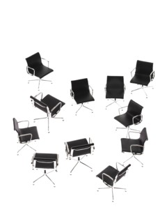 Corporate chairs forming irregular pattern on white background. Photo : David Arky