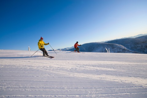 USA, Montana, Whitefish. Two man on ski slope. Photo : Noah Clayton