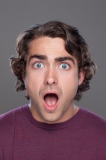 Studio shot of surprised young man. Photo : Rob Lewine