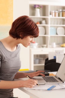 Young woman working at home. Photo : Rob Lewine