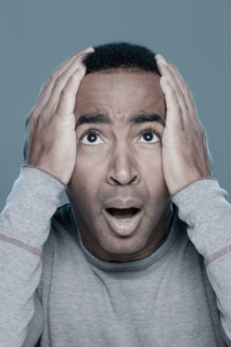 Studio shot of shocked man. Photo : Rob Lewine