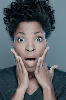 Studio shot of shocked young woman. Photo : Rob Lewine