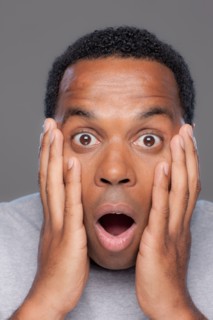 Studio shot of shocked mid adult man. Photo : Rob Lewine