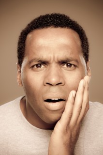 Studio shot of surprised mid adult man. Photo : Rob Lewine