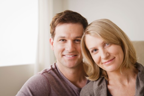 Portrait of smiling mid adult couple. Photo : Rob Lewine