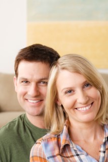 Portrait of smiling mid adult couple. Photo : Rob Lewine
