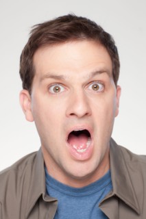 Studio shot of shocked mid adult man. Photo : Rob Lewine