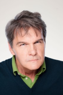 Studio portrait of mature man with facial expression. Photo : Rob Lewine