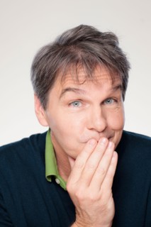 Studio portrait of mature man with facial expression. Photo : Rob Lewine