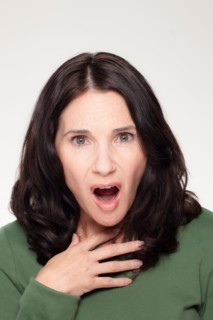 Studio portrait of mature woman with facial expression. Photo : Rob Lewine