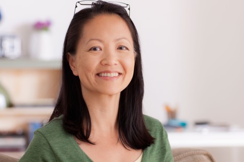 Portrait of woman smiling. Photo : Rob Lewine