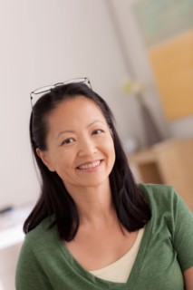 Portrait of woman smiling. Photo : Rob Lewine