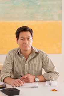 Portrait of man doing paperwork. Photo : Rob Lewine