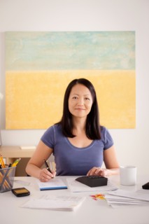 Portrait of woman doing paperwork. Photo : Rob Lewine