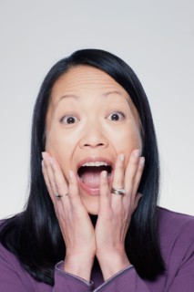 Studio portrait of mature woman screaming. Photo : Rob Lewine
