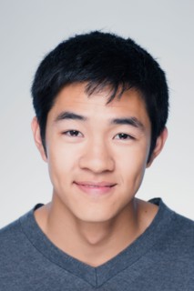 Studio portrait of young man smiling. Photo : Rob Lewine