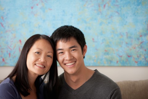 Mother with adult son posing together. Photo : Rob Lewine