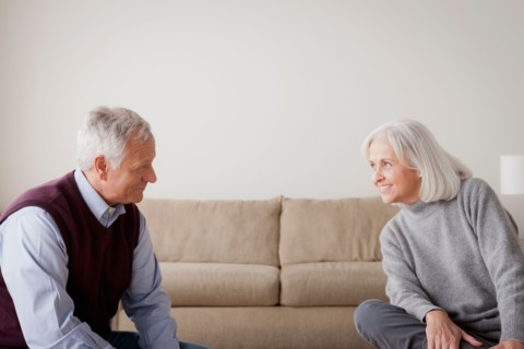 Portrait of senior couple sitting on sofa. Photo : Rob Lewine