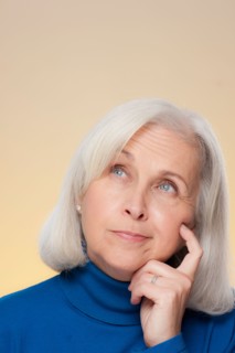 Studio shot of thoughtful senior woman. Photo : Rob Lewine